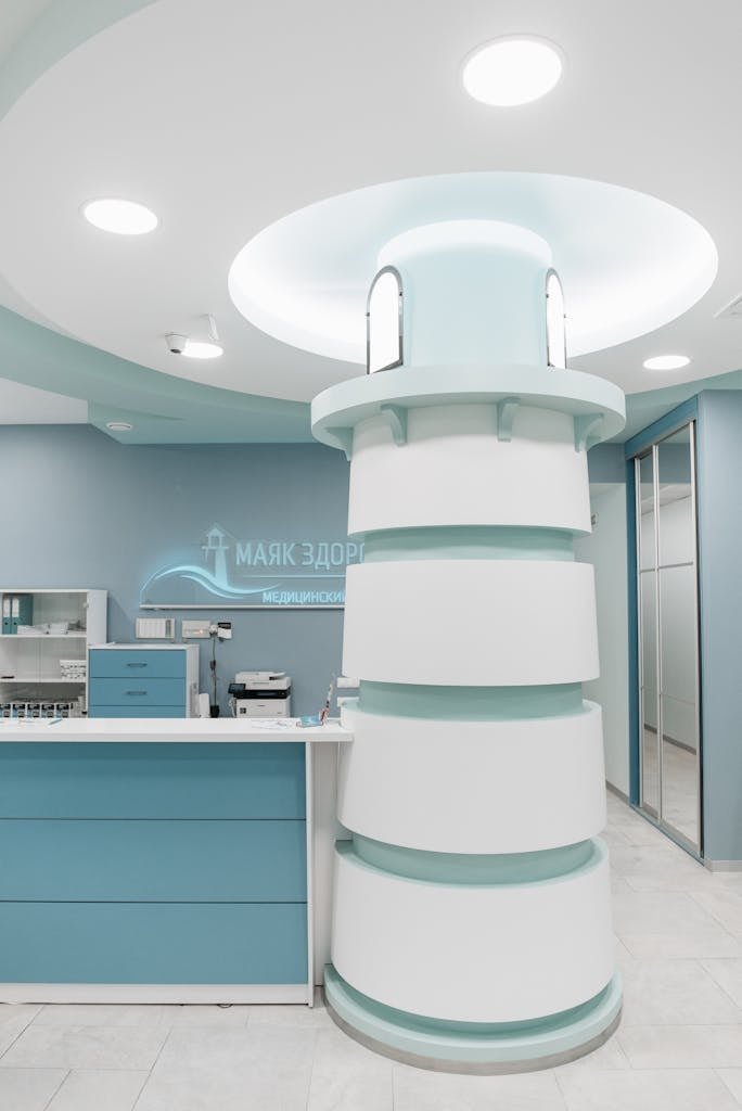 Stylish medical clinic reception area with unique modern design and blue color scheme.
